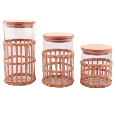 China Freshness Preservation New Design Borosilicate Glass Storage Jar Top With Weave And Wooden Lid Cheap Price Glass Jars Useful Kitchen Glassware for sale