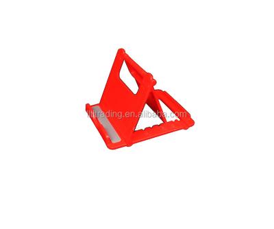 China New Cell Phone Stand Cell Phone Holder Stand Plastic Stock Phone Desktop Plastic Table Cheap Adjustable Foldable Red Handmade Lazy Brackets for sale