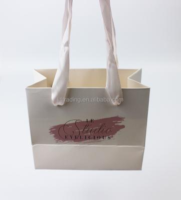 China Recyclable luxury paper bag with ribbon handle pure white with pink logo customized morden wedding paper bags mini gift bags paper candy for sale