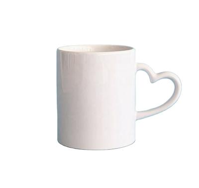 China Disposable Wholesale 11oz Heart Handle Coated Ceramic Coffee Mugs White Empty Sublimation Mugs for sale