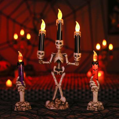 China Electronic Hand Glowing Candle Holder Ghost Carnival LED Skeleton Halloween Party Decoration Halloween Light for sale