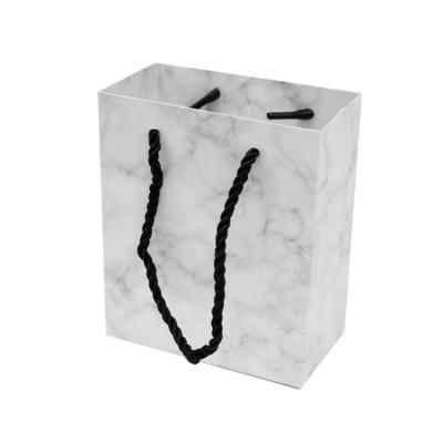 China Small Paper Customized Marble Texture Wedding Door Fragrance Gift Handmade Bags for sale