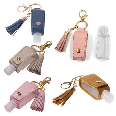 China New Hot Eco-Friendly Tassels Squeeze Bottles Leather Refillable Refillable Hand Wash Bottles Shower Gel Key Chain Holder for sale