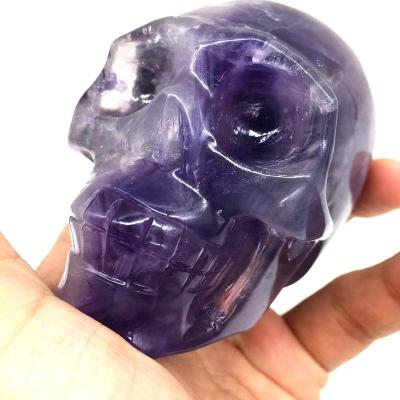 China China Factory Customize Hand Carved Fluorite Crystal Skulls Purple Human Natural Fluorite Skulls For Healing for sale