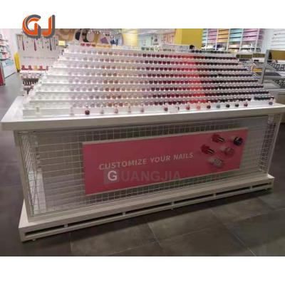 China Double Sides Metal Free Standing Gondola Racks Makeup Shop Nail Polish Shelves Cosmetic Display Stand for sale