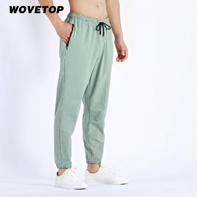 China 2022 wholesale custom logo sports QUICK DRY men training jogging sweatpants running gym white fitness sweatpants for sale