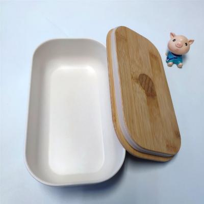 China Sustainable Custom Printed Bamboo Fiber Bento Lunch Box With Wooden Lid And Band for sale