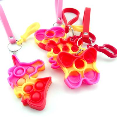 China Worry Relife Toy Red Macarone Rope Key Chain Toy Silicone Funny Leather Strain Sensory Toy for sale