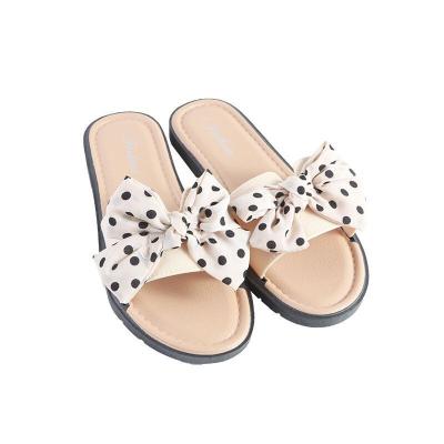 China 2022 fashion trend women's first choice in summer light sandals bow slippers shape beach casual flat bottom slippers for sale