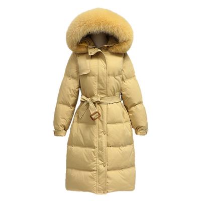 China Anti Wrinkle Jtfur Women Long Down Jacket With Faux Fur Hood Oversize Belted Women Down Coat for sale