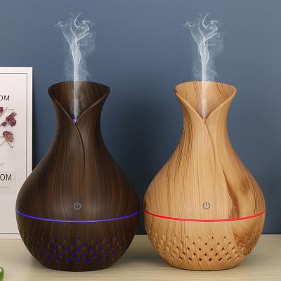 China Best Selling Household/Commercial/Hotel Led Diffuser Mini Changing 7 Colors Lamp Wooden Air Humidifier 130ML Vase Pattern Cavity Aroma Set Essential Oil for sale