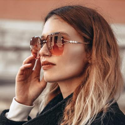 China New Personality Sunglasses Frameless Shaving Glasses Women Bead Leg Polygon Sunglasses for sale