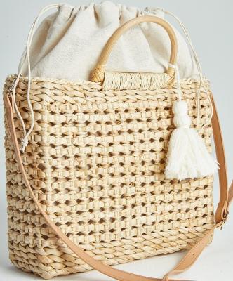 China 100% Handcrafted Eco-friendly Customized Corn Husk Hollow Out Straw Handbag With Two PU Leather Handles, White Tassel for sale