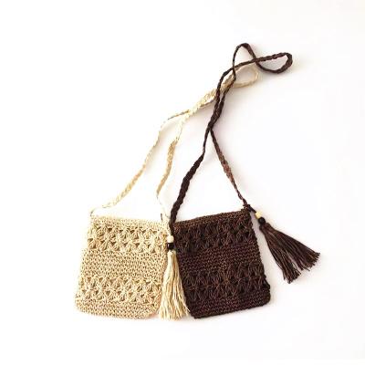 China 100% Hand Made Eco-Friendly Ins Paper Hollows Crochet Cross - Body Straw Bags With Tassel for sale