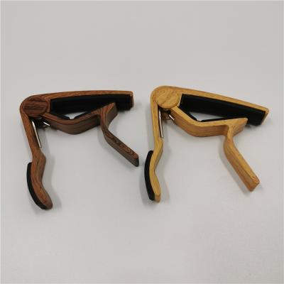 China Guitar. Wholesale UKULELE Musical Instrument Accessories Acoustic Guitar Capo for sale