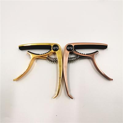 China Guitar. New Design UKULELE Classic Guitar Accessories Wholesale Metal Guitar Capo for sale