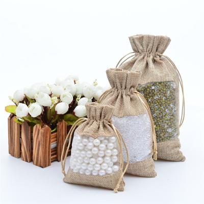 China Reusable Wholesale Custom Sturdy Tissue Candy Bag With See Through The Window Gift Drawstring Bag for sale