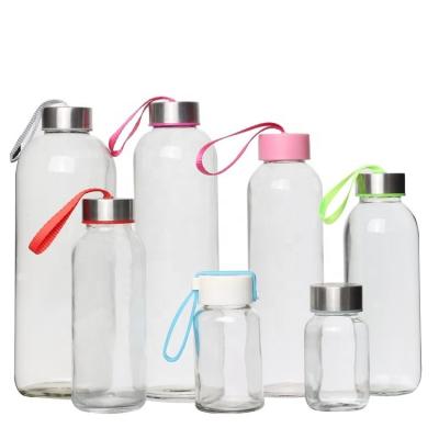 China 500ml 650ml Viable Glitter Clear Borosilicate Glass Water Bottle With Screw Lid for sale