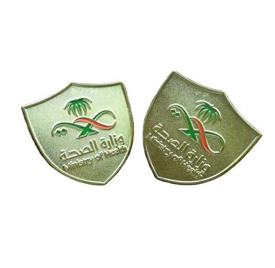 China Global Metal Iron Stamping Soft Gold Plating Enamel Shield Shaped Saudi Arabia Ministry of Health Brooch Badge Label Pins for sale