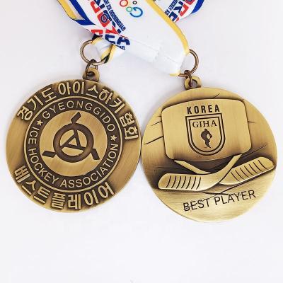 China Liberia Customized Text Plating Embossed Antique Bronze Ice Hockey Medal With Ribbon for sale