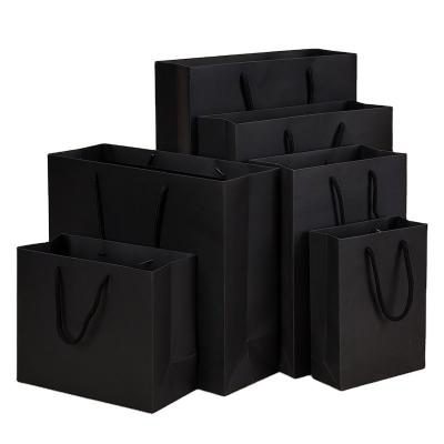 China Wholesale handmade customized high quality personalized black paper bags with logo for sale