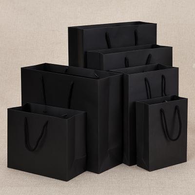 China Recyclable Wholesale Custom Printed Black Luxury Shopping Paper Gift Bag With Handle for sale