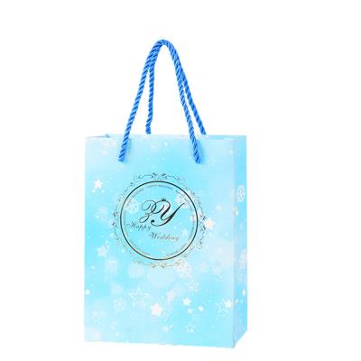 China Handmade wholesale cheap price luxury famous brand gift custom printed shopping paper bag with your own logo for sale