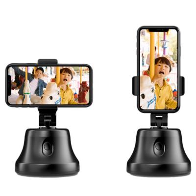 China 360 Degree Rotation Multifunctional Mobile Phone Stand Smart Robot Cameraman Mobile Phone With Auto-face Tracking Gimbal for sale