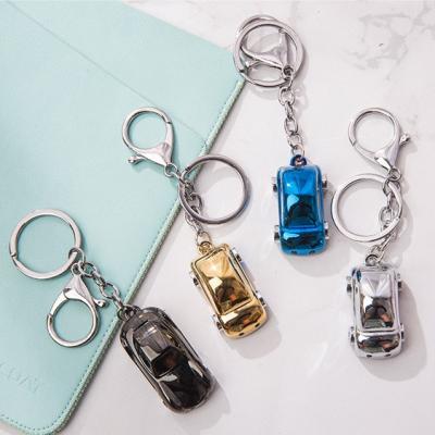 China Hot Metal+plastic mobile phone charm simulation small car interior accessories charm case small car metal key chain for sale