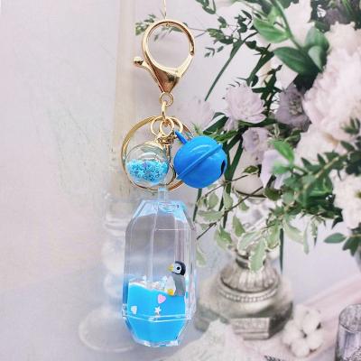 China Metal+plastic milk pig bottle key chain crystal drift drift bottle in oil car liquid key charm crystal bottle charm for sale