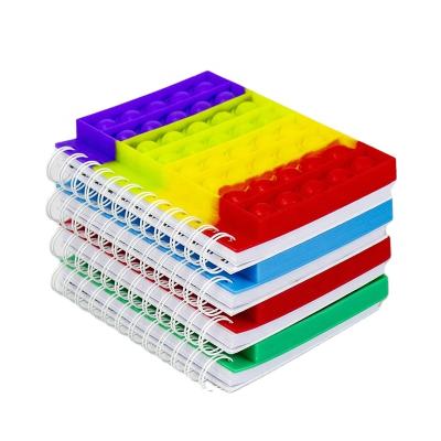 China Cuadernos Escolares Reliver Silicone Spiral Cover Stress Relief Eco-Friendly Push Bubble Rainbow Paper Antistress Notebook For Autism Relief for sale