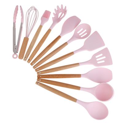 China Sustainable Kitchenware Accessories Kitchenware Pink Cookware Set Pink Silicone Kitchen Utensil Set With Wooden Handle for sale