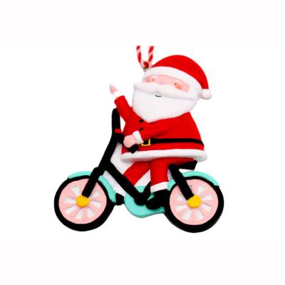 China Christmas Santa Riding Bicycle Ornament Santa Claus Home Decoration Children Gifts Christmas Santa Ornament Resin Crafts for sale