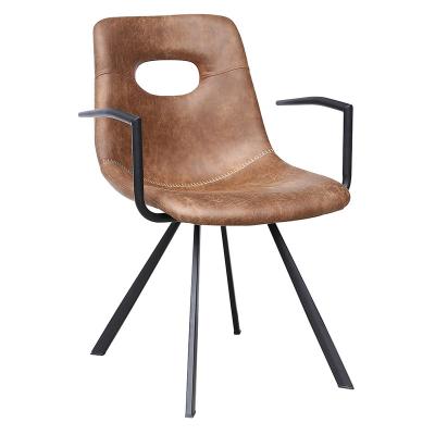 China Convertible Brown Leather Cutout Dining Chairs Nordic Modern Faux Leather Dining Chairs With Metal Armrests for sale