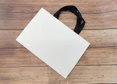 China Cardboard Paper Shopping Bag Eco-friendly Strong sealing bottom SGS,FDA ceritified with black silk ribbon Handle for sale