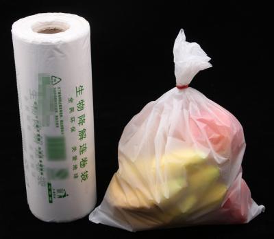 China PLA biodegradation continuous roll bag plastic bag supermarket disposable point broken bag food hand-torn bag for sale