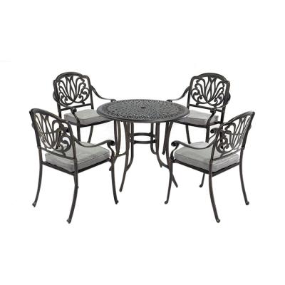 China Traditional Wholesale Cast Aluminum Leisure Stacking Cast Aluminum Table And Chairs for sale