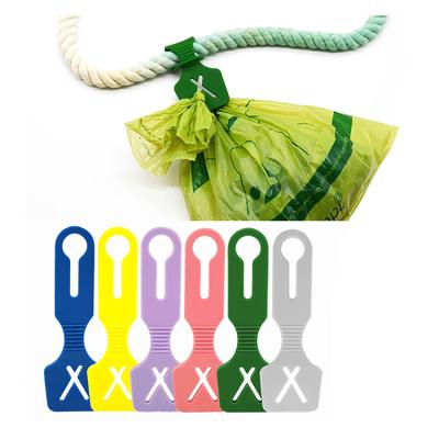 China Sustainable Waste Bag Carrier Hands Holder Poop Bag Clip Free Silicone Poop Bag Holder for sale