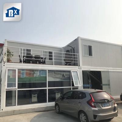 China Modern Low Cost 20ft Sandwich Panel Flat Pack Housing Container Home Modular Home Container Homes for sale