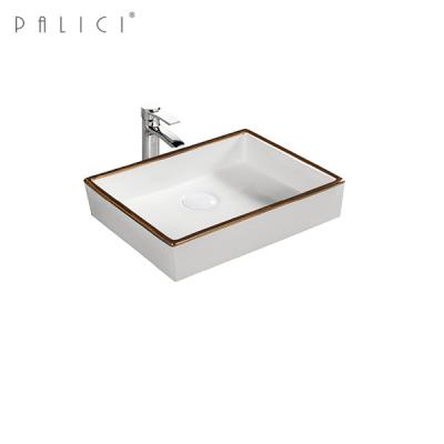 China Modern Line Small Ceramic Sink Lavobo Sink Desgin PALICI Bathroom Golden Toilet for sale