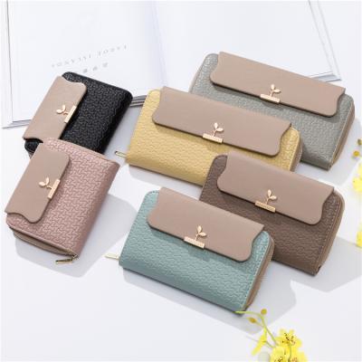 China Durable WAKED Factory Outlet Leaf Buckle Mobile Phone Bag Ladies Triple Purse Long Wallet For Women for sale