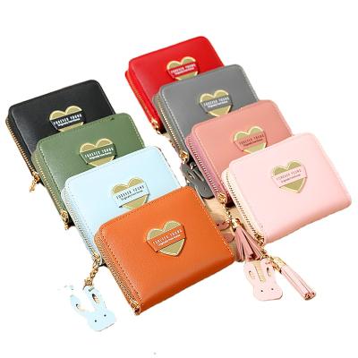 China High Quality WAKED Heart Material Custom Label Tassel Around Zipper Cute PU Women Make Up Purse for sale