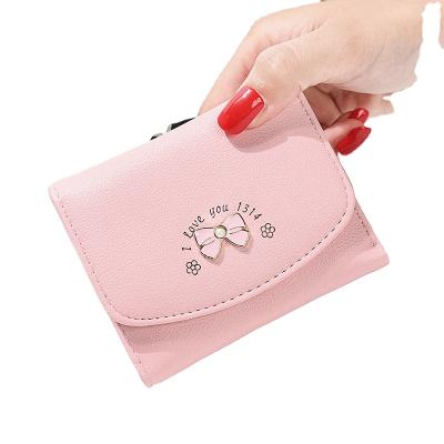 China Multifunctional Explosive Ladies Purses Fashion Three Times Women's Mini Purses Short Student Coin Purses for sale