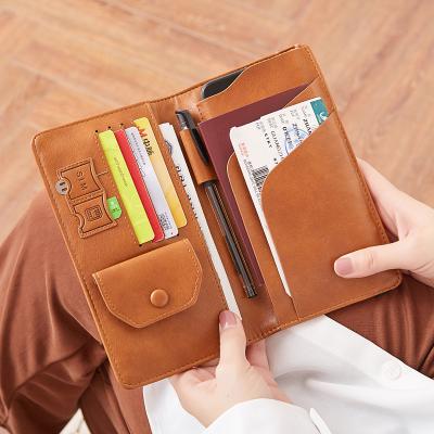 China RFID Blocking WAKED Business Passport and Vaccine Card Holder with SIM Card Holder Position Leather Passport for sale