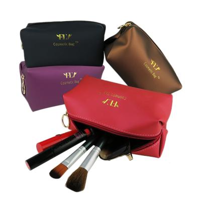 China Large Capacity Fashion Golden Mark Travel Portable Make Up Logo Cosmetic Bag For Ladies Bag for sale