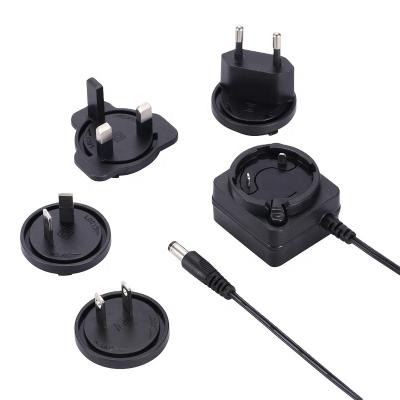 China PC+ABS Fire 100-240v 50-60hz 6v 1a Plug 6w Interchangeable Detachable Power Adapter for sale