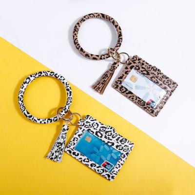 China Vintage AD. Card Leather Bag Wrist Wallet Leopard Print Color Ring Key Chain PU Wallet Key Chain For Women for sale