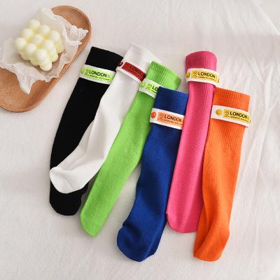 China Spring and Autumn Trend Cotton Middle Tube Children's Socks Antibacterial Solid Color Calf Breathable Socks for sale