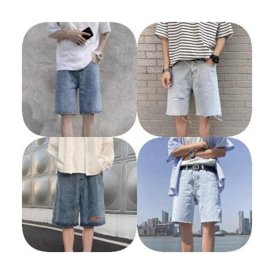 China 2021 Breathable Hot Selling New Mens Fashion Jeans Shorts Distressed Hole Denim Wild Spray Paint Fabric Short Pants For Men for sale