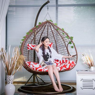 China Modern Cheap Double Seat Patio Rattan Swing Egg Hanging Chair With Stand for sale